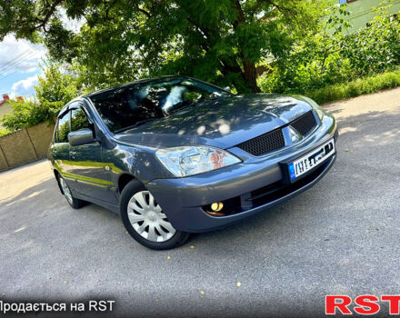 Серый Мицубиси Лансер, объемом двигателя 1.6 л и пробегом 188 тыс. км за 5490 $, фото 6 на Automoto.ua