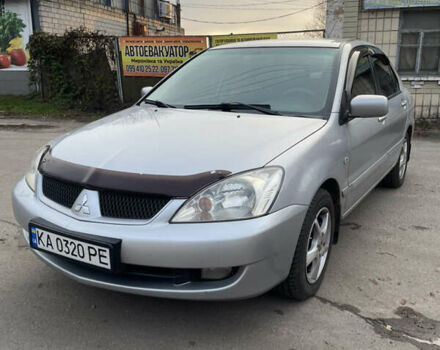 Сірий Міцубісі Lancer, об'ємом двигуна 1.58 л та пробігом 430 тис. км за 2550 $, фото 2 на Automoto.ua