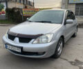 Сірий Міцубісі Lancer, об'ємом двигуна 1.58 л та пробігом 430 тис. км за 2550 $, фото 2 на Automoto.ua