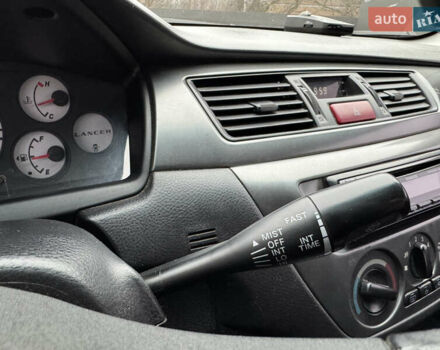 Серый Мицубиси Лансер, объемом двигателя 1.6 л и пробегом 242 тыс. км за 4300 $, фото 24 на Automoto.ua