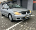 Сірий Міцубісі Lancer, об'ємом двигуна 1.58 л та пробігом 333 тис. км за 2999 $, фото 1 на Automoto.ua