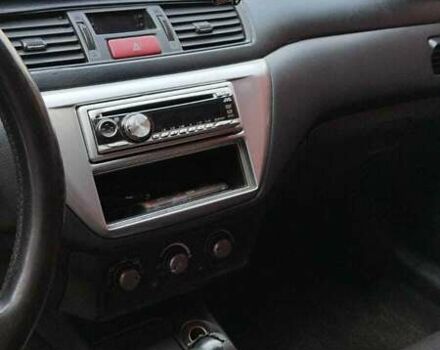 Серый Мицубиси Лансер, объемом двигателя 2 л и пробегом 284 тыс. км за 4100 $, фото 5 на Automoto.ua