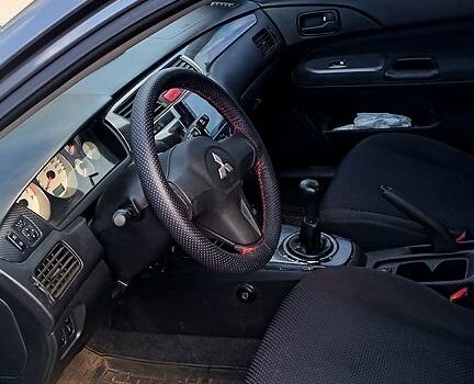 Серый Мицубиси Лансер, объемом двигателя 1.6 л и пробегом 275 тыс. км за 4700 $, фото 3 на Automoto.ua