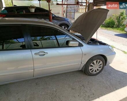 Сірий Міцубісі Lancer, об'ємом двигуна 1.58 л та пробігом 186 тис. км за 4300 $, фото 13 на Automoto.ua