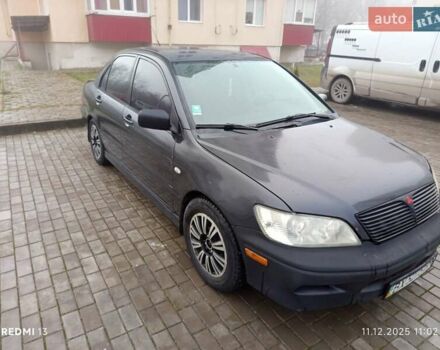 Сірий Міцубісі Lancer, об'ємом двигуна 2 л та пробігом 212 тис. км за 3333 $, фото 4 на Automoto.ua