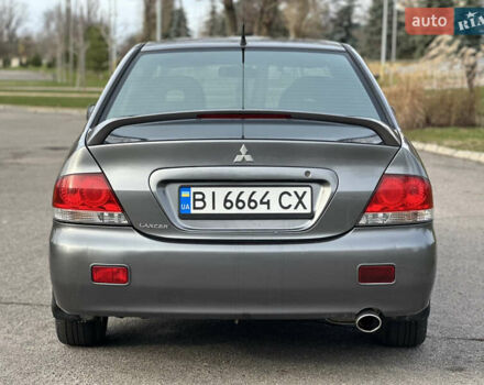 Сірий Міцубісі Lancer, об'ємом двигуна 1.58 л та пробігом 332 тис. км за 4650 $, фото 4 на Automoto.ua