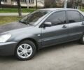Серый Мицубиси Лансер, объемом двигателя 1.6 л и пробегом 263 тыс. км за 3650 $, фото 4 на Automoto.ua