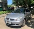 Серый Мицубиси Лансер, объемом двигателя 1.58 л и пробегом 140 тыс. км за 4800 $, фото 1 на Automoto.ua
