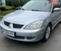 Сірий Міцубісі Lancer, об'ємом двигуна 1.58 л та пробігом 199 тис. км за 4299 $, фото 1 на Automoto.ua