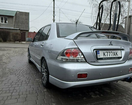 Серый Мицубиси Лансер, объемом двигателя 2 л и пробегом 256 тыс. км за 7000 $, фото 2 на Automoto.ua