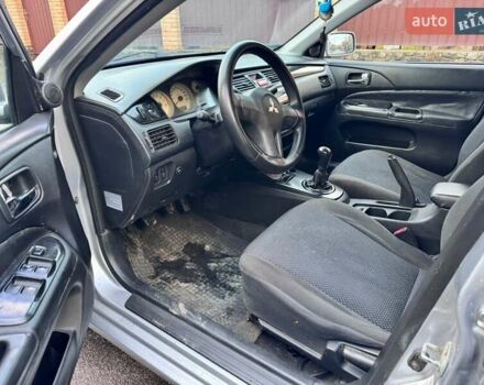 Сірий Міцубісі Lancer, об'ємом двигуна 1.58 л та пробігом 333 тис. км за 2750 $, фото 9 на Automoto.ua