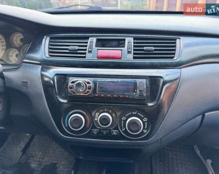 Сірий Міцубісі Lancer, об'ємом двигуна 1.58 л та пробігом 333 тис. км за 2750 $, фото 13 на Automoto.ua