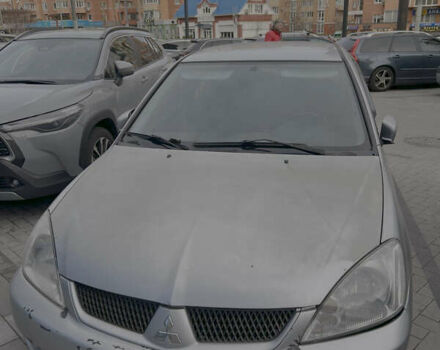 Серый Мицубиси Лансер, объемом двигателя 1.6 л и пробегом 310 тыс. км за 3500 $, фото 3 на Automoto.ua