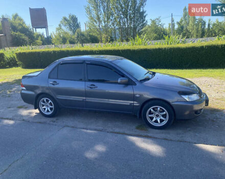 Серый Мицубиси Лансер, объемом двигателя 1.6 л и пробегом 291 тыс. км за 3900 $, фото 3 на Automoto.ua