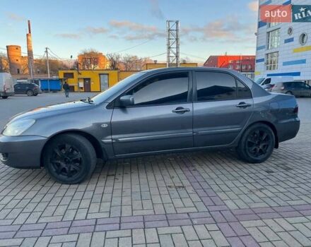 Серый Мицубиси Лансер, объемом двигателя 1.6 л и пробегом 279 тыс. км за 3990 $, фото 3 на Automoto.ua