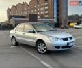 Сірий Міцубісі Lancer, об'ємом двигуна 1.58 л та пробігом 223 тис. км за 5500 $, фото 1 на Automoto.ua