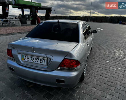 Сірий Міцубісі Lancer, об'ємом двигуна 1.58 л та пробігом 333 тис. км за 2999 $, фото 7 на Automoto.ua
