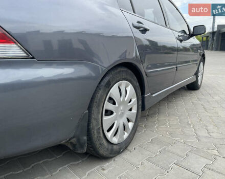 Сірий Міцубісі Lancer, об'ємом двигуна 1.58 л та пробігом 162 тис. км за 4650 $, фото 4 на Automoto.ua