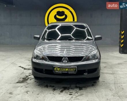 Серый Мицубиси Лансер, объемом двигателя 1.58 л и пробегом 300 тыс. км за 4600 $, фото 1 на Automoto.ua