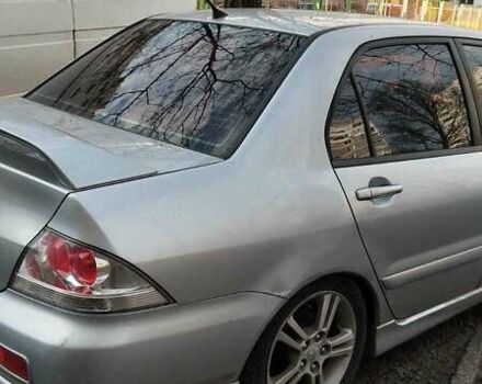 Серый Мицубиси Лансер, объемом двигателя 2 л и пробегом 284 тыс. км за 4100 $, фото 6 на Automoto.ua