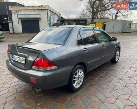Сірий Міцубісі Lancer, об'ємом двигуна 1.6 л та пробігом 262 тис. км за 4400 $, фото 3 на Automoto.ua