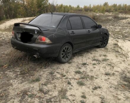 Міцубісі Lancer 2006 у Синельниковом на Automoto.ua Сірий Міцубісі Lancer, об'ємом двигуна 2 л та пробігом 200 тис. км за 3000 $, фото 2 на Automoto.ua