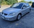 Сірий Міцубісі Lancer, об'ємом двигуна 1.6 л та пробігом 240 тис. км за 2559 $, фото 1 на Automoto.ua