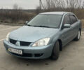 Сірий Міцубісі Lancer, об'ємом двигуна 1.58 л та пробігом 267 тис. км за 5300 $, фото 1 на Automoto.ua