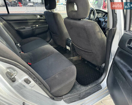 Сірий Міцубісі Lancer, об'ємом двигуна 1.58 л та пробігом 333 тис. км за 2700 $, фото 15 на Automoto.ua