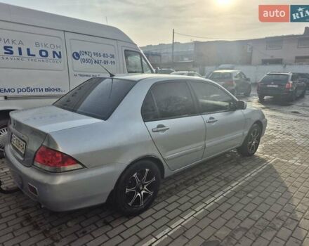 Серый Мицубиси Лансер, объемом двигателя 1.58 л и пробегом 301 тыс. км за 3500 $, фото 5 на Automoto.ua