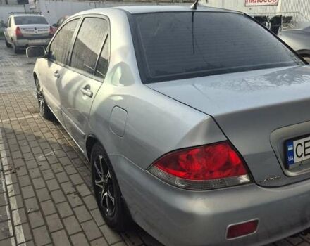 Серый Мицубиси Лансер, объемом двигателя 1.58 л и пробегом 301 тыс. км за 3500 $, фото 4 на Automoto.ua