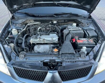 Серый Мицубиси Лансер, объемом двигателя 1.6 л и пробегом 279 тыс. км за 3990 $, фото 7 на Automoto.ua