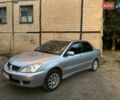 Сірий Міцубісі Lancer, об'ємом двигуна 1.6 л та пробігом 225 тис. км за 4200 $, фото 3 на Automoto.ua