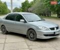 Серый Мицубиси Лансер, объемом двигателя 1.58 л и пробегом 177 тыс. км за 3500 $, фото 1 на Automoto.ua