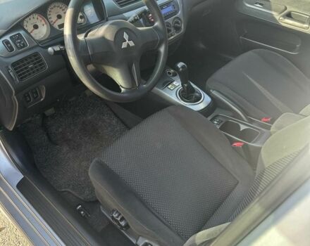 Серый Мицубиси Лансер, объемом двигателя 1.6 л и пробегом 170 тыс. км за 3700 $, фото 6 на Automoto.ua