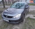 Серый Мицубиси Лансер, объемом двигателя 2 л и пробегом 209 тыс. км за 4800 $, фото 1 на Automoto.ua