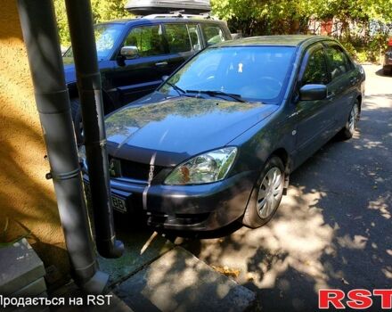 Серый Мицубиси Лансер, объемом двигателя 1.6 л и пробегом 177 тыс. км за 4000 $, фото 8 на Automoto.ua