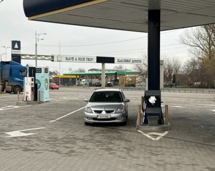 Серый Мицубиси Лансер, объемом двигателя 2 л и пробегом 256 тыс. км за 7000 $, фото 1 на Automoto.ua