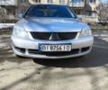 Серый Мицубиси Лансер, объемом двигателя 1.6 л и пробегом 348 тыс. км за 4800 $, фото 1 на Automoto.ua