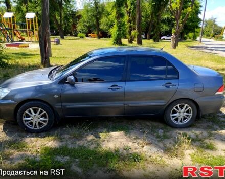 Серый Мицубиси Лансер, объемом двигателя 1.6 л и пробегом 214 тыс. км за 4500 $, фото 8 на Automoto.ua