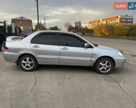 Сірий Міцубісі Lancer, об'ємом двигуна 1.58 л та пробігом 430 тис. км за 2550 $, фото 8 на Automoto.ua