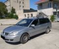Серый Мицубиси Лансер, объемом двигателя 1.6 л и пробегом 147 тыс. км за 5200 $, фото 1 на Automoto.ua
