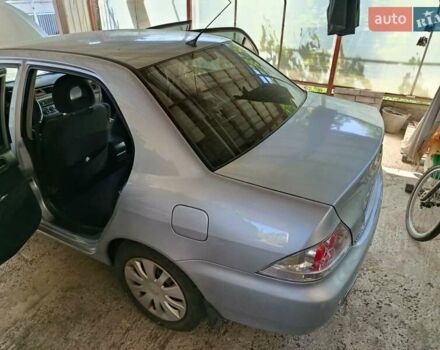 Сірий Міцубісі Lancer, об'ємом двигуна 1.58 л та пробігом 186 тис. км за 4300 $, фото 15 на Automoto.ua