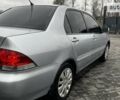 Сірий Міцубісі Lancer, об'ємом двигуна 1.6 л та пробігом 170 тис. км за 4200 $, фото 11 на Automoto.ua