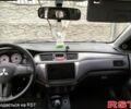 Серый Мицубиси Лансер, объемом двигателя 1.6 л и пробегом 244 тыс. км за 5000 $, фото 4 на Automoto.ua