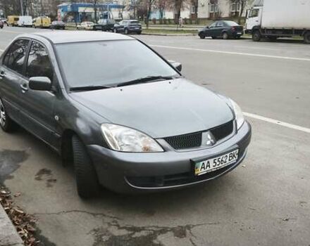 Серый Мицубиси Лансер, объемом двигателя 1.6 л и пробегом 263 тыс. км за 3650 $, фото 1 на Automoto.ua
