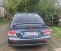 Серый Мицубиси Лансер, объемом двигателя 2 л и пробегом 240 тыс. км за 4200 $, фото 7 на Automoto.ua