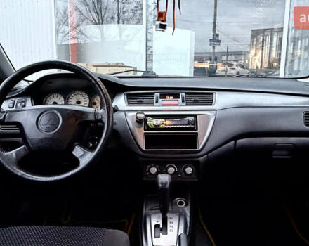 Сірий Міцубісі Lancer, об'ємом двигуна 1.58 л та пробігом 275 тис. км за 4600 $, фото 18 на Automoto.ua