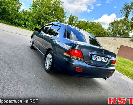 Серый Мицубиси Лансер, объемом двигателя 1.6 л и пробегом 188 тыс. км за 5490 $, фото 3 на Automoto.ua