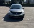 Серый Мицубиси Лансер, объемом двигателя 1.6 л и пробегом 300 тыс. км за 4799 $, фото 2 на Automoto.ua